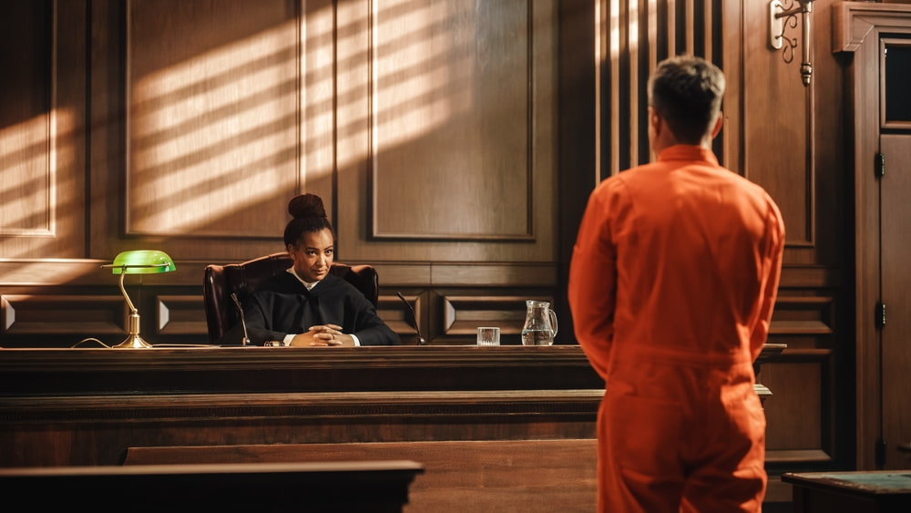 Men in orange jumpsuits during a trial in court representing the article's topic about Forcible Sexual Penetration Penal Code 289