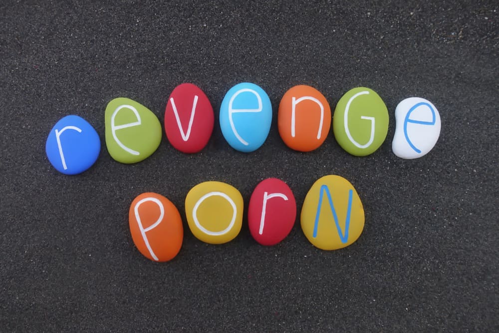 text with multi colored stones with "revenge porn" written to illustrate what the article "Understanding California’s Revenge Porn Law" is about