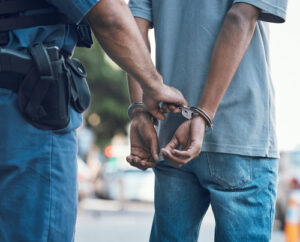 police arresting a suspect representing the article's topic about Understanding the Basics of Arrest Warrants and Search Warrants in Los Angeles