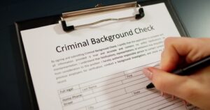 a background check sheet being filled up representing the article about What is Diversion and Intervention in Lieu of Conviction?