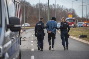 man is arrested by police officers representing the article about What is Probable Cause?