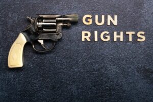 Gun rights concept on a blue background with text and a pistol